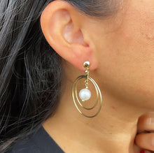 Load image into Gallery viewer, 18k Gold Filled Double Stacked Hoop Earrings Featuring Simulated Pearl Dangling In The Middle