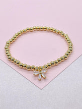 Load image into Gallery viewer, 18k Gold Filled Elastic Classic 4mm Beaded Bracelet with CZ Dainty Bow