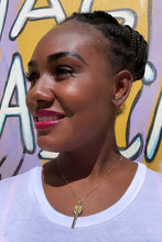 Load image into Gallery viewer, May include: A person wearing a white t-shirt and a gold chain necklace with a key pendant.