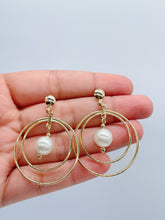 Load image into Gallery viewer, 18k Gold Filled Double Stacked Hoop Earrings Featuring Simulated Pearl Dangling In The Middle
