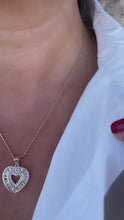 Load and play video in Gallery viewer, 18k Gold Filled Heart Pendant Crowned with Baguette Cut Stones And Round CZ Stones
